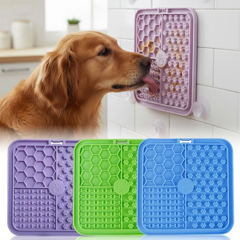 Lick mat attached to a tiled shower wall with suction cups at dog head height